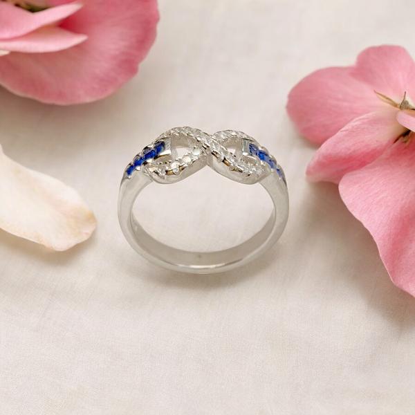 Ring with Infinity Style Top and Blue Stone