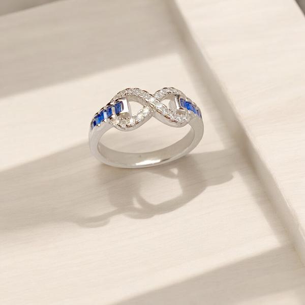 Ring with Infinity Style Top and Blue Stone